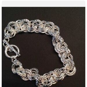 Stunning!  Intricate multi link bracelet!  .925 sterling clad… toggle closure.
